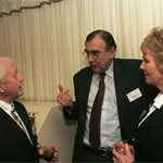 LowCVP Board member and MIRA MD, John Wood (c) with David Andrews of SMMT (l) and partner.